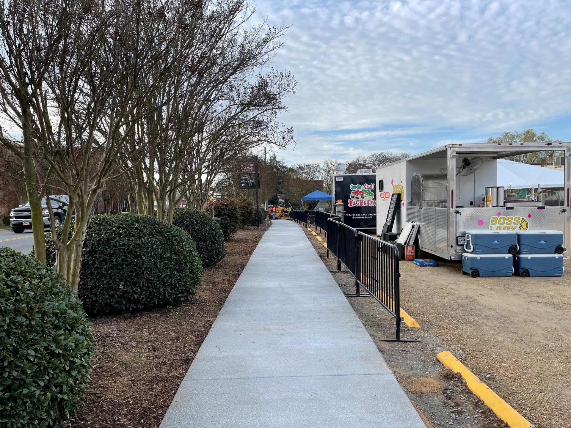 sidewalk parallel to broome facing south